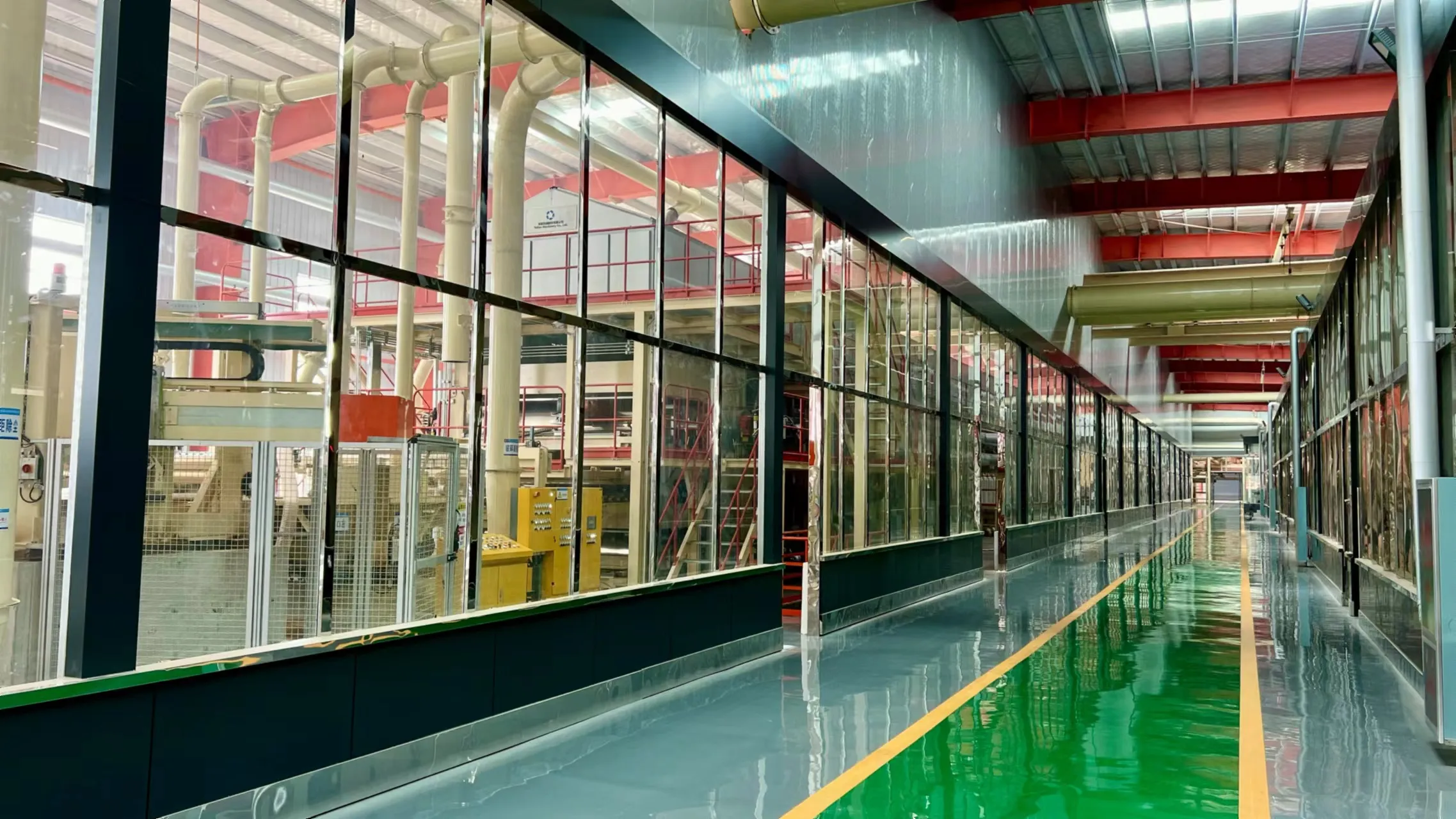 Glass-walled viewing corridor overlooking a Ningfeng production line