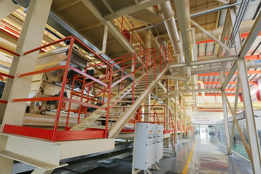 Elevated red-railed walkway threading through a Ningfeng continuous-press line structure